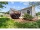 Backyard view featuring well-maintained lawn and patio at 1107 Rachel Anne Dr, Belmont, NC 28012