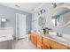 Spacious bathroom boasting double sink vanity, large mirror, soaking tub, and tile flooring at 1107 Rachel Anne Dr, Belmont, NC 28012