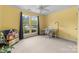 Bright bedroom with neutral carpet, large windows, and built in desk at 1107 Rachel Anne Dr, Belmont, NC 28012