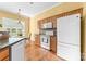 Bright kitchen with white appliances, wooden cabinets, and eat in breakfast nook at 1107 Rachel Anne Dr, Belmont, NC 28012