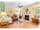 Bright living room with fireplace, hardwood floors, and ceiling fan at 1107 Rachel Anne Dr, Belmont, NC 28012