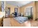 Home office featuring neutral colors, large windows, and hardwood floors at 1107 Rachel Anne Dr, Belmont, NC 28012