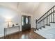 Elegant foyer with hardwood floors, staircase, and a decorative front door with stained glass at 1121 S Wendover Rd, Charlotte, NC 28211