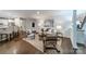 Inviting living room with neutral decor, ample seating, a woven rug, and lots of natural light at 1121 S Wendover Rd, Charlotte, NC 28211