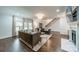 Bright and spacious living room featuring hardwood floors, fireplace, and large windows at 1121 S Wendover Rd, Charlotte, NC 28211