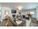 Open concept living room features hardwood floors, a fireplace, and stylish furnishings at 1121 S Wendover Rd, Charlotte, NC 28211