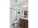 Bright bathroom featuring a granite-topped vanity, a toilet, and a shower with a stylish curtain at 1155 Rudder Cir, Salisbury, NC 28146