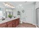 Well-lit bathroom with double vanity, granite countertops, and a separate toilet room for added privacy at 1155 Rudder Cir, Salisbury, NC 28146