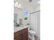 Well-lit bathroom with a granite countertop and a shower with a white curtain at 1155 Rudder Cir, Salisbury, NC 28146