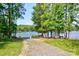 Scenic view of a boat ramp leading to a tranquil lake surrounded by lush greenery at 1155 Rudder Cir, Salisbury, NC 28146