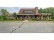 Charming clubhouse featuring stone accents, a cozy porch, and well-maintained landscaping at 1155 Rudder Cir, Salisbury, NC 28146