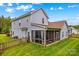 Charming exterior view featuring a screened-in porch and well-manicured backyard at 1155 Rudder Cir, Salisbury, NC 28146