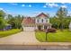 Two-story home with a well-maintained lawn, two-car garage, and a cozy front porch at 1155 Rudder Cir, Salisbury, NC 28146