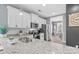A pristine kitchen showcases stainless steel appliances, a granite countertop, and is open to the breakfast area at 1155 Rudder Cir, Salisbury, NC 28146