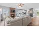 Open concept living room and kitchen with seating at the kitchen island and a cozy fireplace at 1155 Rudder Cir, Salisbury, NC 28146