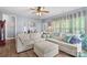 Comfortable living room featuring a large sectional sofa, natural light, and wood flooring at 1155 Rudder Cir, Salisbury, NC 28146