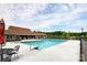 A beautiful community pool and clubhouse with ample seating on a sunny day at 1155 Rudder Cir, Salisbury, NC 28146