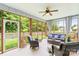 Relaxing screened-in porch with comfortable seating and a view of the backyard at 1155 Rudder Cir, Salisbury, NC 28146