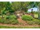 Stone community entrance sign amid lush landscaping, creating a welcoming first impression at 1155 Rudder Cir, Salisbury, NC 28146