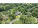Aerial view of charming home surrounded by lush landscaping and mature trees at 120 Pinewood Ln, Rock Hill, SC 29730