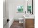 Bright bathroom featuring modern fixtures, wood-look flooring, and a shower-tub combo, offering a functional and stylish design at 120 Pinewood Ln, Rock Hill, SC 29730