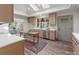 Kitchen showcasing wood cabinets, stainless steel dishwasher, and a rustic wood table at 120 Pinewood Ln, Rock Hill, SC 29730