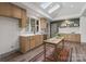 Bright kitchen featuring wood cabinets, stainless steel appliances and skylights at 120 Pinewood Ln, Rock Hill, SC 29730