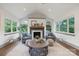 Inviting living room featuring a cozy fireplace, ample natural light, and stylish decor at 120 Pinewood Ln, Rock Hill, SC 29730