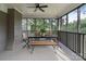 Dining table and seating on the screened porch, perfect for outdoor meals and relaxation at 120 Pinewood Ln, Rock Hill, SC 29730