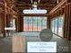 A social and entertaining room with a tray ceiling and plenty of natural light at 1200 Andover Rd, Charlotte, NC 28211