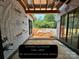 Covered outdoor grill area and patio, great for entertaining and enjoying the outdoors at 1200 Andover Rd, Charlotte, NC 28211