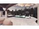 Luxury outdoor pool with lush landscaping and outdoor dining area at 1200 Andover Rd, Charlotte, NC 28211
