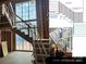 Staircase construction featuring metal balusters and handrail with a modern design at 1200 Andover Rd, Charlotte, NC 28211