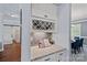 Chic bar area with granite countertop, wine rack, and glass storage at 12214 Bonny Oaks Dr, Cornelius, NC 28031