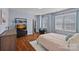Bright and spacious bedroom features hardwood floors, ample natural light, and a cozy seating area at 12214 Bonny Oaks Dr, Cornelius, NC 28031