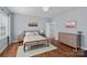 Cozy bedroom with a minimalist design, hardwood floors, and soft colors for a relaxing atmosphere at 12214 Bonny Oaks Dr, Cornelius, NC 28031