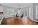 Charming breakfast nook featuring wood floors, a round table, and views to the deck at 12214 Bonny Oaks Dr, Cornelius, NC 28031