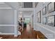 Spacious foyer with hardwood floors, staircase, trim detail, and views into the living spaces create a welcoming entry at 12214 Bonny Oaks Dr, Cornelius, NC 28031