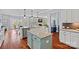 Bright kitchen with a center island, stainless appliances, and an open concept to the breakfast nook and living room at 12214 Bonny Oaks Dr, Cornelius, NC 28031