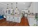 Open kitchen with granite countertops, stainless steel appliances, and a center island with barstool seating at 12214 Bonny Oaks Dr, Cornelius, NC 28031
