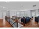Cozy loft featuring hardwood floors and a comfortable seating area at 12214 Bonny Oaks Dr, Cornelius, NC 28031