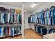 Walk-in closet with organized storage solutions, shelves, and clothing racks for ample space at 12214 Bonny Oaks Dr, Cornelius, NC 28031