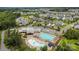 Aerial view of the neighborhood with a community pool, clubhouse, parking, and attractive landscaping at 1230 Therns Ferry Dr, Fort Mill, SC 29708