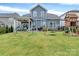 Expansive backyard featuring lush lawn, playground, swing set, and patio area at 1230 Therns Ferry Dr, Fort Mill, SC 29708