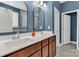 Bathroom showcasing double sinks, modern fixtures, and stylish blue walls at 1230 Therns Ferry Dr, Fort Mill, SC 29708