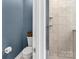 Modern bathroom featuring a toilet, glass-enclosed shower, and sleek design at 1230 Therns Ferry Dr, Fort Mill, SC 29708