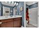 Well lit bathroom with dual sinks, framed mirror, and private toilet and shower space at 1230 Therns Ferry Dr, Fort Mill, SC 29708