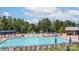 Large community pool with ample seating, umbrellas, and splash pad at 1230 Therns Ferry Dr, Fort Mill, SC 29708