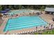 A lovely community pool with several sections for swimming and lounging on a sunny day at 1230 Therns Ferry Dr, Fort Mill, SC 29708