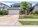 Lovely home with a well-maintained lawn, front porch seating, a basketball hoop, and a two-car garage at 1230 Therns Ferry Dr, Fort Mill, SC 29708